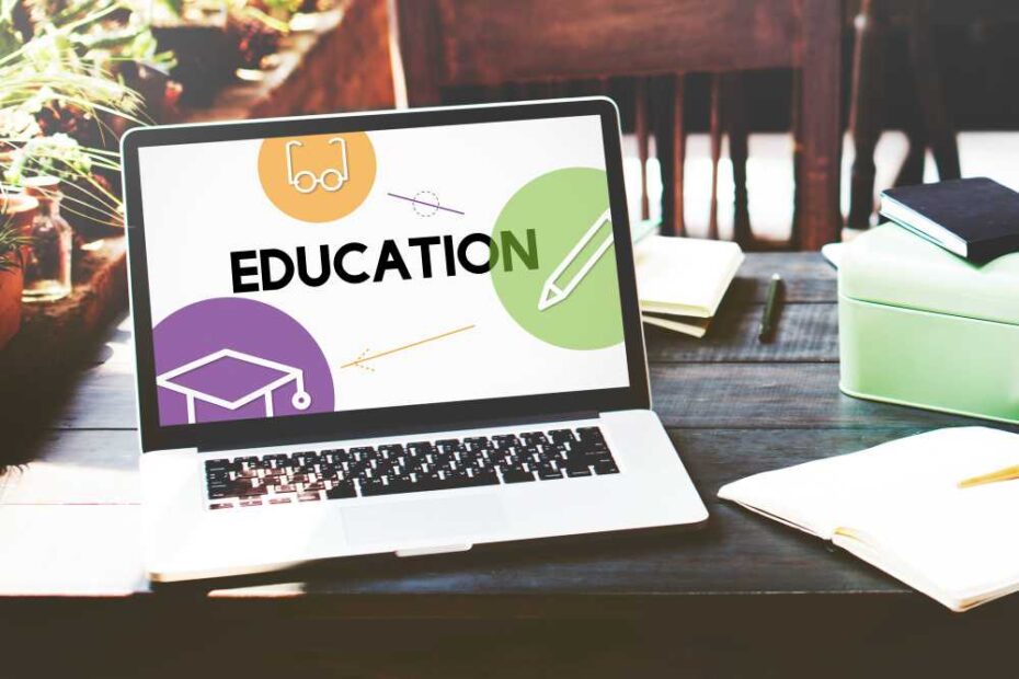 A laptop displaying the text EDUCATION