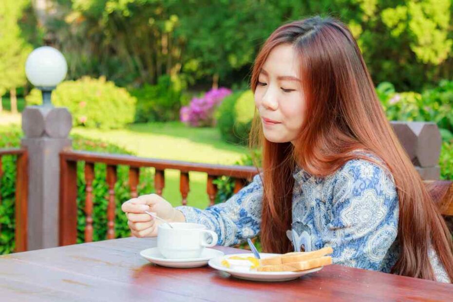 A young woman is having a breakfast