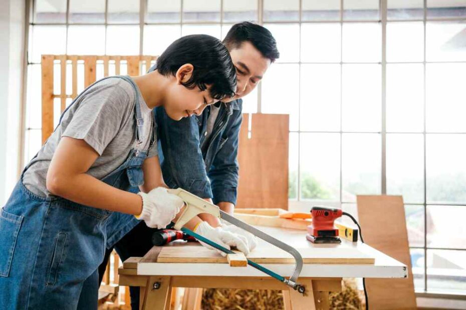 Two carpenters are making furniture.